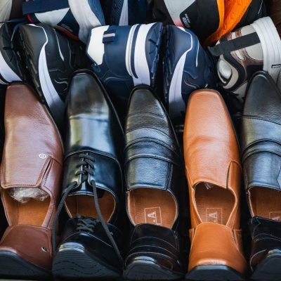 A variety of leather and sports shoes on display at a street market in Colombo, Sri Lanka.